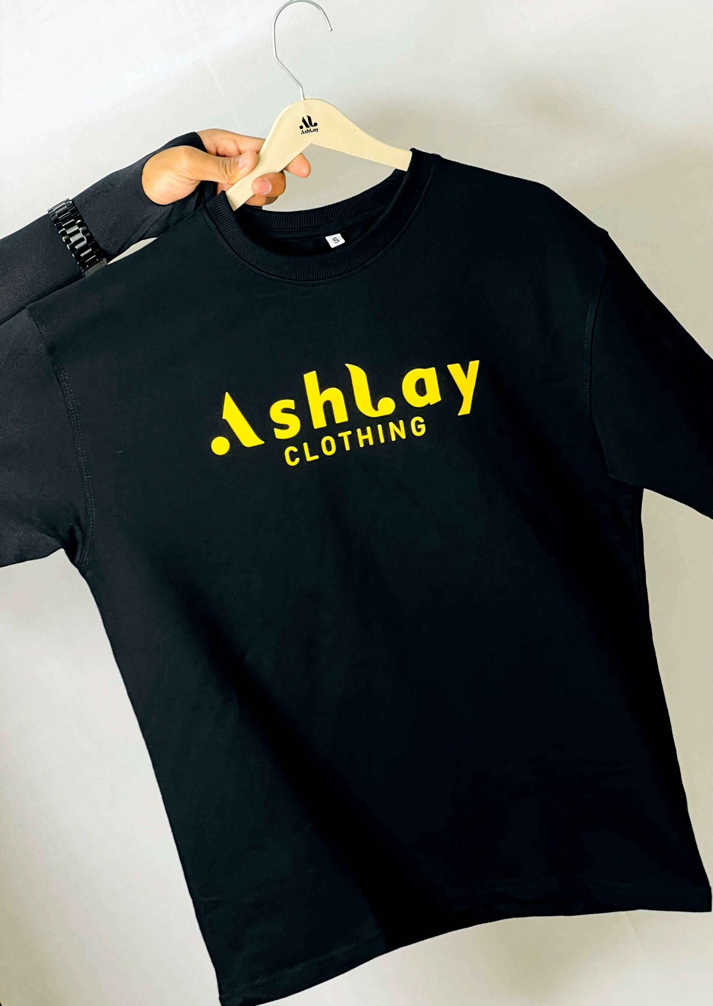 Ashlay Be The Hero oversized t-shirt – bold front print
Back View	Inspirational streetwear tee by Ashlay – Be The Hero back design
Model Wearing	Ashlay motivational oversized tee worn by model – Be The Hero edition
Close-Up	Close-up of Be The Hero print – Ashlay statement streetwear tee